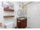 Cozy bathroom featuring a granite vanity, shiplap walls, and stylish pendant lighting at 4142 Reif Ct, Port Charlotte, FL 33981