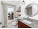 Stylish bathroom featuring granite countertop, wood vanity, and modern fixtures at 4142 Reif Ct, Port Charlotte, FL 33981