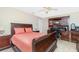 Spacious bedroom features a full desk setup, soft carpet, and a large bed with wood accents at 4142 Reif Ct, Port Charlotte, FL 33981