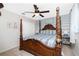 Luxurious bedroom showcasing a four-poster bed and soft color palette at 4142 Reif Ct, Port Charlotte, FL 33981
