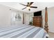 Bright and comfortable bedroom with a four-poster bed, neutral colors, and a view from the window at 4142 Reif Ct, Port Charlotte, FL 33981