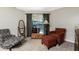 Relaxing sitting area in the primary bedroom with a pool view at 4142 Reif Ct, Port Charlotte, FL 33981
