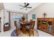 Dining area with a view, a ceiling fan, and stylish furnishings at 4142 Reif Ct, Port Charlotte, FL 33981