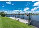 A private dock equipped with a table sits right along the canal's edge at 4142 Reif Ct, Port Charlotte, FL 33981