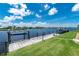 A private dock with boat lift and table provides easy access to the waterfront at 4142 Reif Ct, Port Charlotte, FL 33981