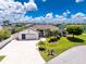 Well-manicured lawn complements this inviting single-story home with a two-car garage, mature landscaping, and charming curb appeal at 4142 Reif Ct, Port Charlotte, FL 33981