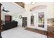 Inviting foyer showcases double doors, tile flooring, and high ceilings, complemented by tasteful decor and ample natural light at 4142 Reif Ct, Port Charlotte, FL 33981