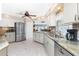 Well-lit kitchen with stainless steel appliances, granite countertops, and a view at 4142 Reif Ct, Port Charlotte, FL 33981