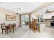 Bright kitchen featuring granite countertops, tile flooring and a breakfast bar, with pool views at 4142 Reif Ct, Port Charlotte, FL 33981