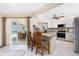 Kitchen with a breakfast bar and a view of the pool and waterfront at 4142 Reif Ct, Port Charlotte, FL 33981