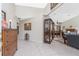 Spacious open-concept living area featuring tile flooring seamlessly connecting the dining area, and comfortable furnishings at 4142 Reif Ct, Port Charlotte, FL 33981