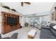 Comfortable living room with large built-in entertainment center and lots of natural light at 4142 Reif Ct, Port Charlotte, FL 33981