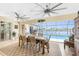 Relaxing lanai with a pool, scenic waterfront views, and comfortable outdoor dining area at 4142 Reif Ct, Port Charlotte, FL 33981