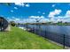 A serene waterfront view from the lawn, showcasing the canal and neighborhood at 4142 Reif Ct, Port Charlotte, FL 33981