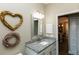 Bathroom showcasing single sink vanity with granite countertop and decorative mirror at 4640 W Price Blvd, North Port, FL 34286