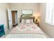 Bedroom featuring queen bed, window, and doorway at 4640 W Price Blvd, North Port, FL 34286