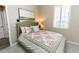 Bedroom featuring queen bed, window, and neutral decor at 4640 W Price Blvd, North Port, FL 34286