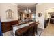 Open dining room with a wood table, view into the living room, and stylish decor at 4640 W Price Blvd, North Port, FL 34286