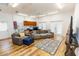 Spacious living room features hardwood floors, neutral furniture, and natural light at 4640 W Price Blvd, North Port, FL 34286