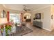 Cozy living room with ample seating, sliding doors to the patio, and stylish decor at 4640 W Price Blvd, North Port, FL 34286
