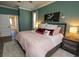 The main bedroom features an accent wall, neutral decor, and a doorway leading to the bathroom at 4640 W Price Blvd, North Port, FL 34286