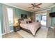 The main bedroom has a ceiling fan, access to the pool, and en suite bathroom at 4640 W Price Blvd, North Port, FL 34286