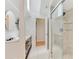 Bathroom featuring stylish tile and a sleek glass-enclosed shower, all bathed in natural light at 510 Border St, Port Charlotte, FL 33953
