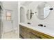 Elegant bathroom with a double sink vanity, modern fixtures, and ample storage space at 510 Border St, Port Charlotte, FL 33953