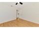 Bright bedroom with light hardwood floors and a ceiling fan for a refreshing breeze at 510 Border St, Port Charlotte, FL 33953