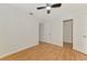 Bright bedroom featuring light hardwood floors and multiple doorways that enhance the space at 510 Border St, Port Charlotte, FL 33953