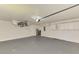 Spacious garage featuring ample storage cabinets, an automatic door opener, and a clean, organized layout at 510 Border St, Port Charlotte, FL 33953