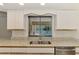 Kitchen features granite counters and a view of the pool at 510 Border St, Port Charlotte, FL 33953