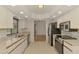 Bright kitchen features stainless steel appliances, tile backsplash, and granite countertops at 510 Border St, Port Charlotte, FL 33953