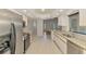 Modern kitchen equipped with stainless steel appliances, granite countertops, and tile flooring at 510 Border St, Port Charlotte, FL 33953
