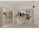 Bright kitchen featuring white cabinetry, stainless steel appliances, and a granite countertop island at 510 Border St, Port Charlotte, FL 33953