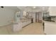 Bright kitchen featuring white cabinetry, granite countertops, and modern appliances at 510 Border St, Port Charlotte, FL 33953