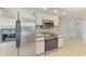 Updated kitchen features stainless steel appliances and white cabinets at 510 Border St, Port Charlotte, FL 33953