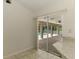 Bright eat-in-kitchen area with granite countertops and a sliding glass doors leading to the pool at 510 Border St, Port Charlotte, FL 33953
