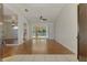 Open living room featuring wood floors, natural light, and a seamless indoor-outdoor flow at 510 Border St, Port Charlotte, FL 33953