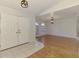 Bright and open living area with wood floors, double doors, and natural light from the windows at 510 Border St, Port Charlotte, FL 33953