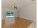 Light-filled living room with wood floors offering a view of the pool and patio at 510 Border St, Port Charlotte, FL 33953