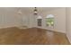 Spacious living room features wood floors, arched windows, and a modern light fixture at 510 Border St, Port Charlotte, FL 33953