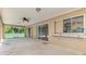 Wide-open patio space with a ceiling fan, a convenient serving window, and plenty of room for outdoor enjoyment at 510 Border St, Port Charlotte, FL 33953