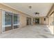 Expansive covered patio featuring sliding glass doors leading to the interior and a ceiling fan for added comfort at 510 Border St, Port Charlotte, FL 33953