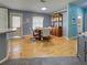 Charming dining area featuring a wooden table with four chairs, adjacent to the kitchen at 6562 Hikina Dr, North Port, FL 34287