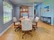 Cozy dining area with a wooden table and chairs at 6562 Hikina Dr, North Port, FL 34287