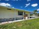 A charming single-story home with well-kept lawn and stone landscaping at 6562 Hikina Dr, North Port, FL 34287