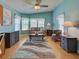Bright and airy living room featuring a ceiling fan and stylish furniture, with a comfortable seating area at 6562 Hikina Dr, North Port, FL 34287