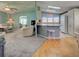 Open-concept layout with combined living room and kitchen areas, perfect for entertaining at 6562 Hikina Dr, North Port, FL 34287