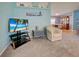 Comfortable living room featuring beachy decor, plush carpet, and ample seating at 6562 Hikina Dr, North Port, FL 34287